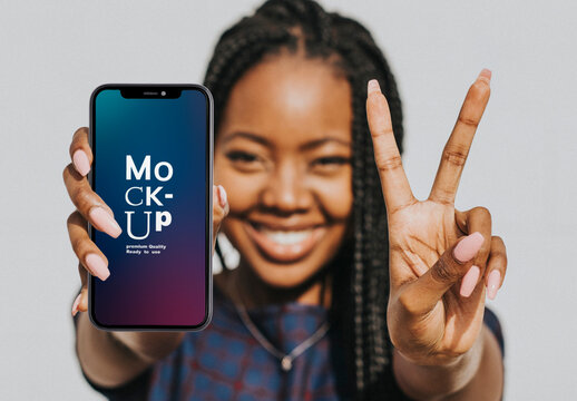 Woman Showing A V Sign With A Phone Mockup