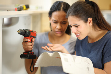 Confused women reforming house reading instruction manual