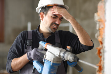 Construction worker suffering head ache