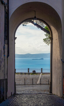 Lake Bolsena seen through city gate of Montefiascone, Viterbo Province, Lazio, Italy