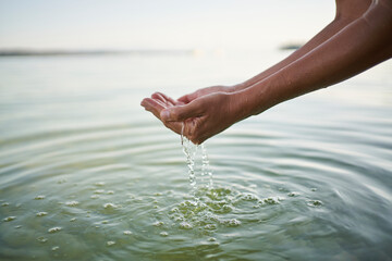 Mature woman holding water in cupped hands