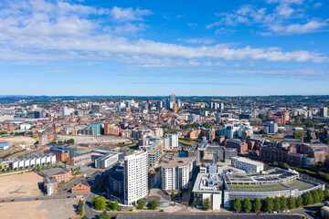 Obraz premium Aerial photo of the Leeds City Centre showing the area in Leeds knows as the Docks on a sunny summers day with the Clarence House apartments over looking the whole of of the city of Leeds