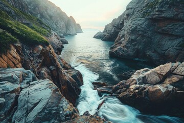 A river carving its way through a rocky canyon, symbolizing the resilience and determination needed...