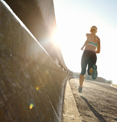Sports, running and back of woman on bridge for race, marathon or endurance training. Fitness,...
