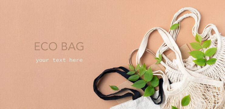 Plastic free set with various cotton bag decorated green leaves top view. Zero waste, eco friendly concept. Flat lay. - Powered by Adobe