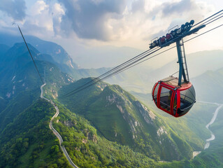 A cable car ascends a lush green mountain slope on a scenic journey to the top.