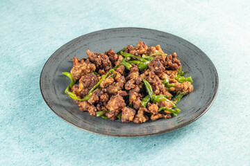 Stir Fried Green Chilli Chicken Dry served in plate isolated on sky background side view of bangladeshi food