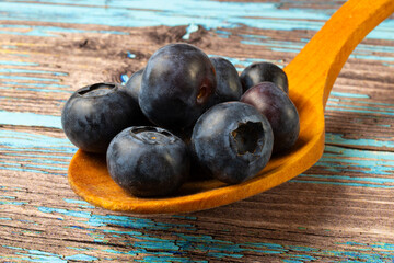 blueberries on a wooden spoon
