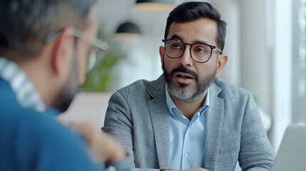 Obraz premium Two professionals having a business conversation. Casual and modern office setting. Focus on collaboration and discussion. AI