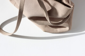 Fashion. Stylish Beige Suede Bag on White Background.