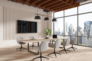 Beige conference interior with table and chairs, tv screen and panoramic window