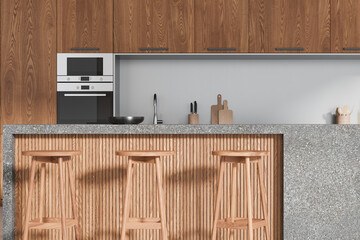 Wooden home kitchen interior with bar counter and stool, cooking cabinet