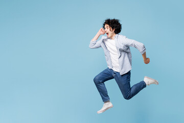 Full body side profile view young man wear shirt white t-shirt casual clothes jump high run fast...