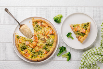Homemade pie with salmon and broccoli