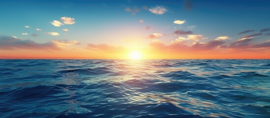 Obraz premium Sunset light illuminates the surface of the deep blue sea with a captivating view that offers a peaceful and tranquil setting for a copy space image