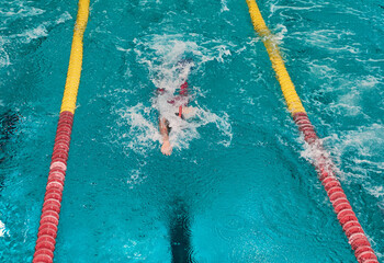 Finswimming World Championships. Aquatics bifins sports. Athletes competing in blue swimming pool.