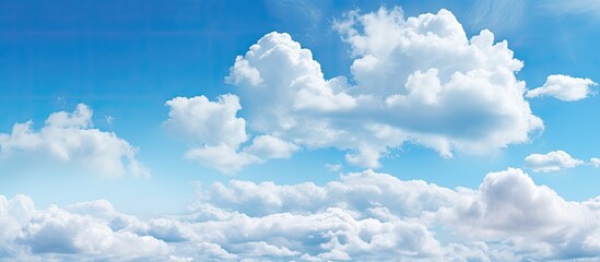 Clouds in the sky create a beautiful natural backdrop suitable for a variety of design projects that require copy space image