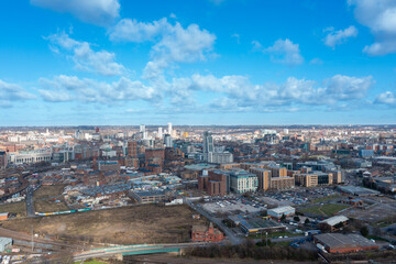 Fototapeta premium Aerial photo of the British town of Leeds in West Yorkshire UK, showing the Leeds City Centre taken with with a drone on a bright sunny day in the town of Holbeck near to the centre.