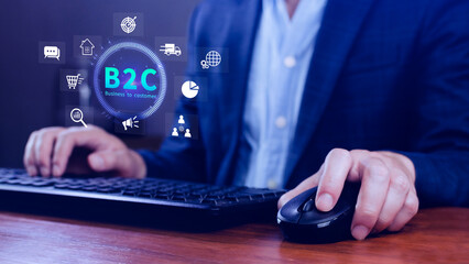 B2C, Business to customer marketing strategy concept. Businessman holding with virtual B2C icon for business strategy, communication, feedback, online marketing, Ecommerce marketing strategy.