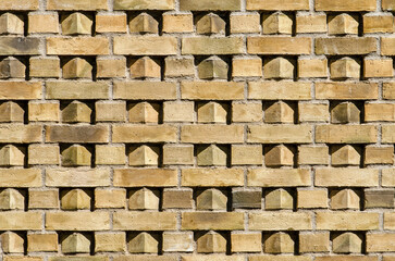 Sunlight and shadow add an extra layer of interest to a decorative brick facade in Leiden, The Netherlands