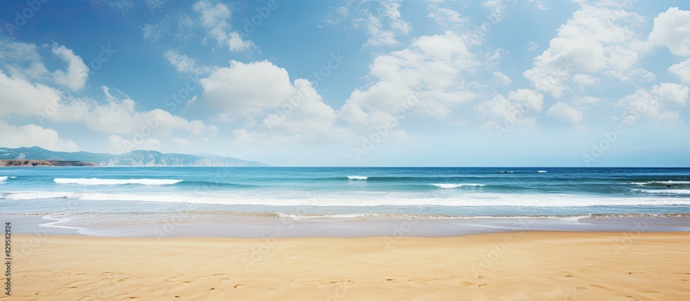 Poster Scenic view with beautiful blue sky over sandy beach in a picturesque and stunning image with copy space