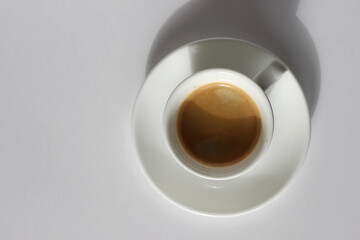 Espresso. Freshly Brewed Cup of Espresso Coffee with Crema Foam on White Background. Cafe.