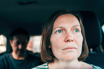Dissatisfied couple having a dispute in the car