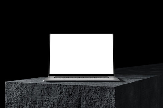 Laptop with a blank screen on a stone table, dark background. A modern scene perfect for placing your own content on the screen. Minimalist, professional look.