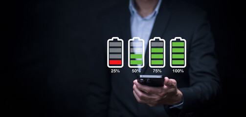 business man holding  mobile smart phones charging , Battery icon set.Battery supply concept....
