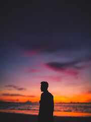 Silhouette of a man in a beautiful sunset. Beautiful sunset at Ngurbloat Beach, Southeast Maluku, Indonesia.