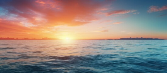 Fototapeta premium A panoramic view of the sunrise over the sea with an expansive copy space image