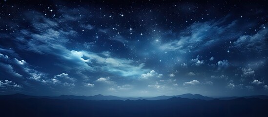 A serene summer night with a dark blue sky filled with twinkling stars light white clouds moving swiftly creating a peaceful atmosphere. Copy space image. Place for adding text and design