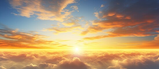 Obraz premium The golden morning sky adorned with clouds of different shapes creates a beautiful sunrise scene with copy space image