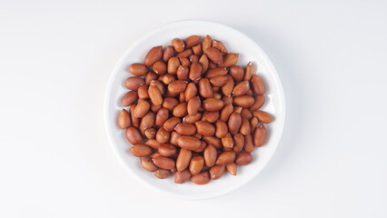 raw peanuts on a white background with studio lighting