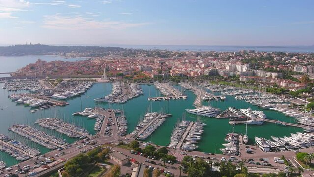 Antibes, France: Aerial view of Port Vauban Antibes and Antibes Marina in famous resort town by Mediterranean Sea on French Riviera - landscape panorama of Europe from above
