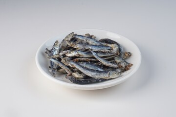 salted anchovies on a white background with studio lighting, in Indonesia is called 