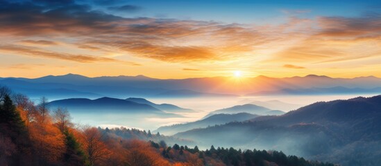 Fototapeta premium Scenic sunrise over a vibrant fall mountain landscape with copy space image