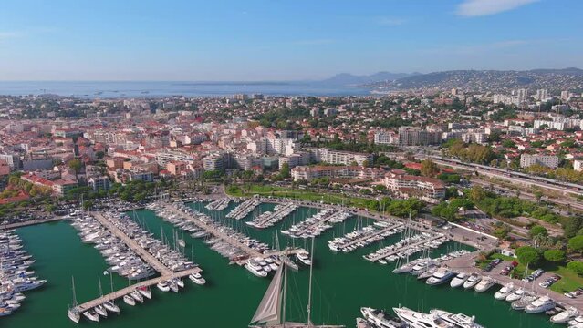 Antibes, France: Aerial view of Port Vauban Antibes and Antibes Marina in famous resort town by Mediterranean Sea on French Riviera - landscape panorama of Europe from above

