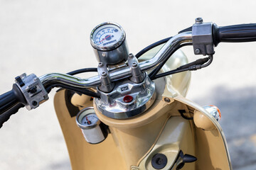 details of analog speedometer on vintage motorbike, shallow depth of field