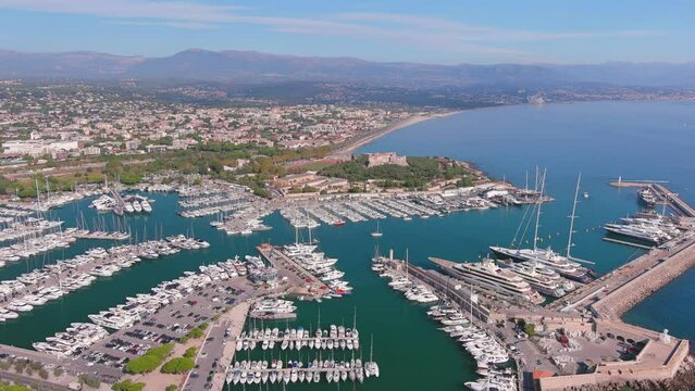 Antibes, France: Aerial view of Port Vauban Antibes and Antibes Marina in famous resort town by Mediterranean Sea on French Riviera - landscape panorama of Europe from above
