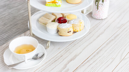 Afternoon tea stand with sweet treats, Afternoon tea set with dessert, High tea set with dessert.