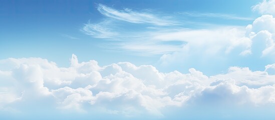 Abstract soft blue sky with white clouds creating a blurry backdrop with ample copy space image for branding featuring hues transitioning from white to blue in a template design concept