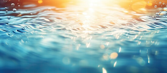 Abstract bokeh background with sun reflections on blurred ripple water in swimming pool ideal for copy space image