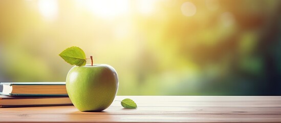 A green apple placed on a wooden table with books symbolizing education and a back to school theme creating a composition suitable for a copy space image - Powered by Adobe