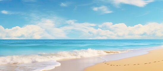 Beach scene with clear blue skies and golden sand perfect for a copy space image