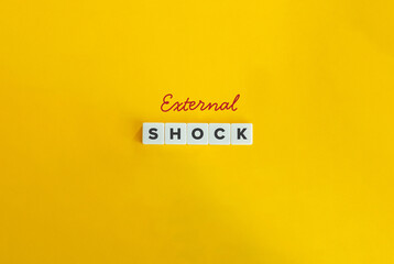 External Shock Term. Abrupt Changes In Economic Conditions. Text on Letter Tiles on Yellow Background. Minimalist Aesthetics.