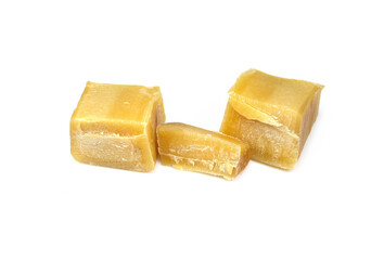 Pure natural Bees Wax (Beeswax) as it Comes Out of the Hive. Melted and Broken into Pieces. Used in Medicine, Cosmetics and Candle Making. Isolated on White. Beeswax wax heap isolated on white 