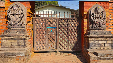 Statues of Ugrachandi and Bhairava outside museum door, Bhaktapur Durbar Square, Kathmandu, Nepal.