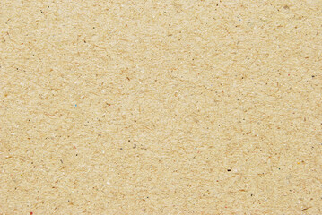 A sheet of beige recycled cardboard texture as background