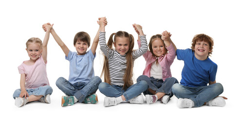 Group of cute children holding hands on white background